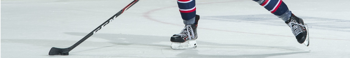 Ice hockey skates and stick