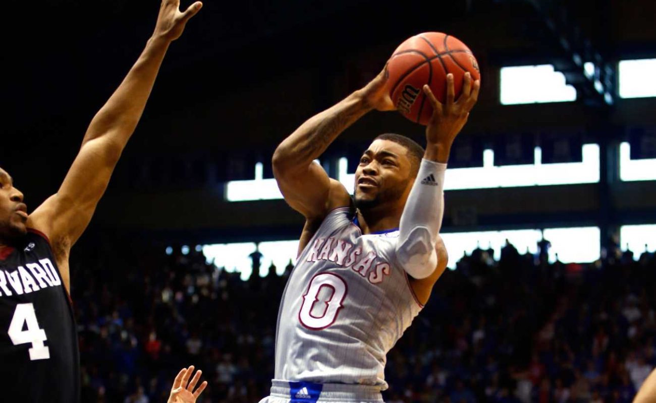 Frank Mason III #0 of the Kansas Jayhawks drives to the basket during the game against the Harvard Crimson at Allen Fieldhouse