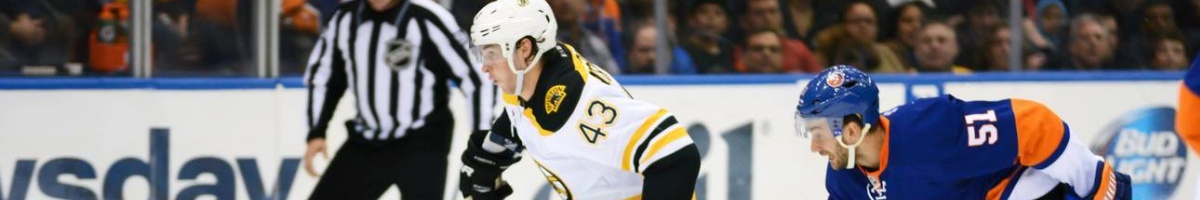 Game action between the Boston Bruins and New York Islanders