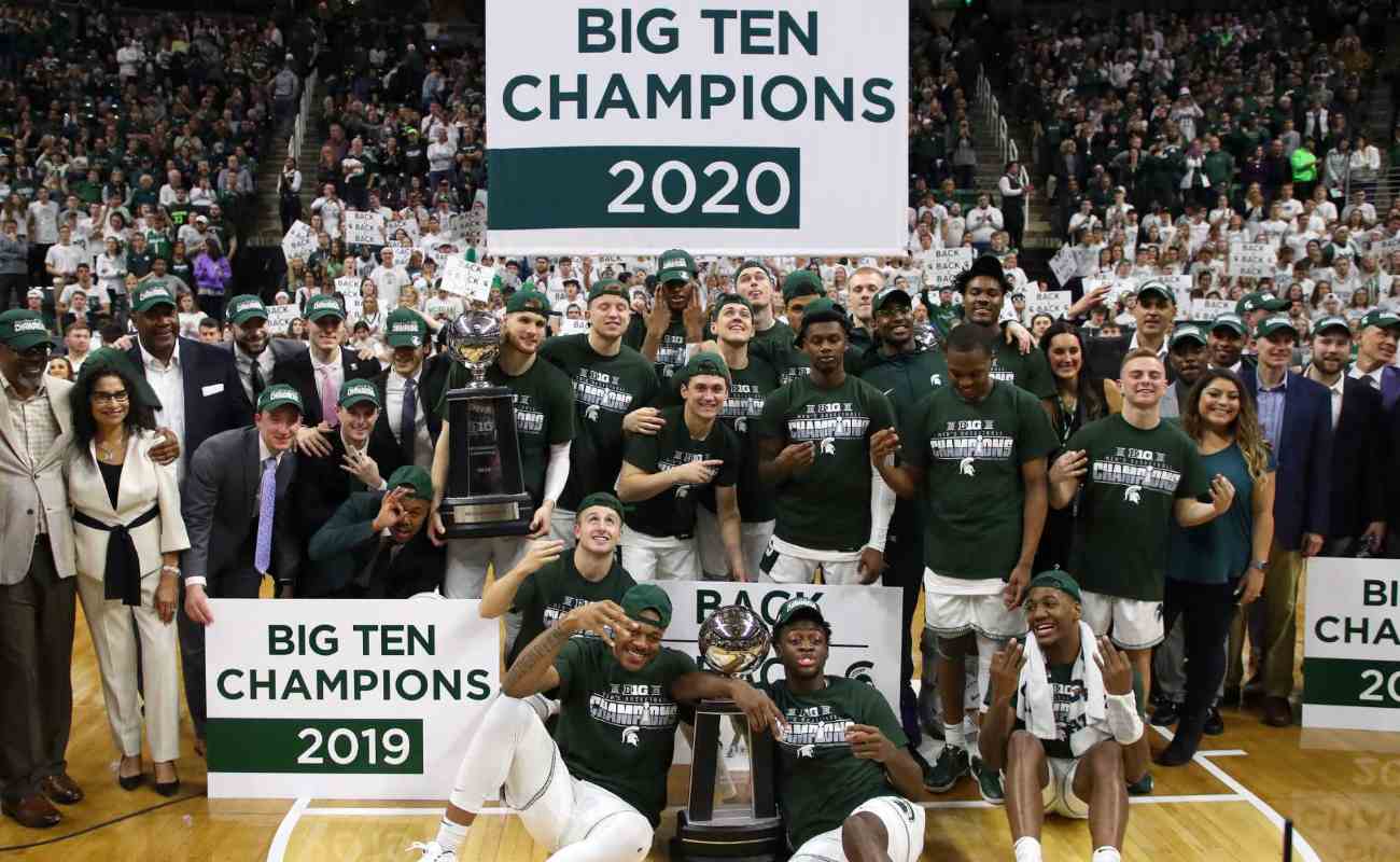 The Michigan State Spartans celebrate their share of a Big Ten Championship March 2020