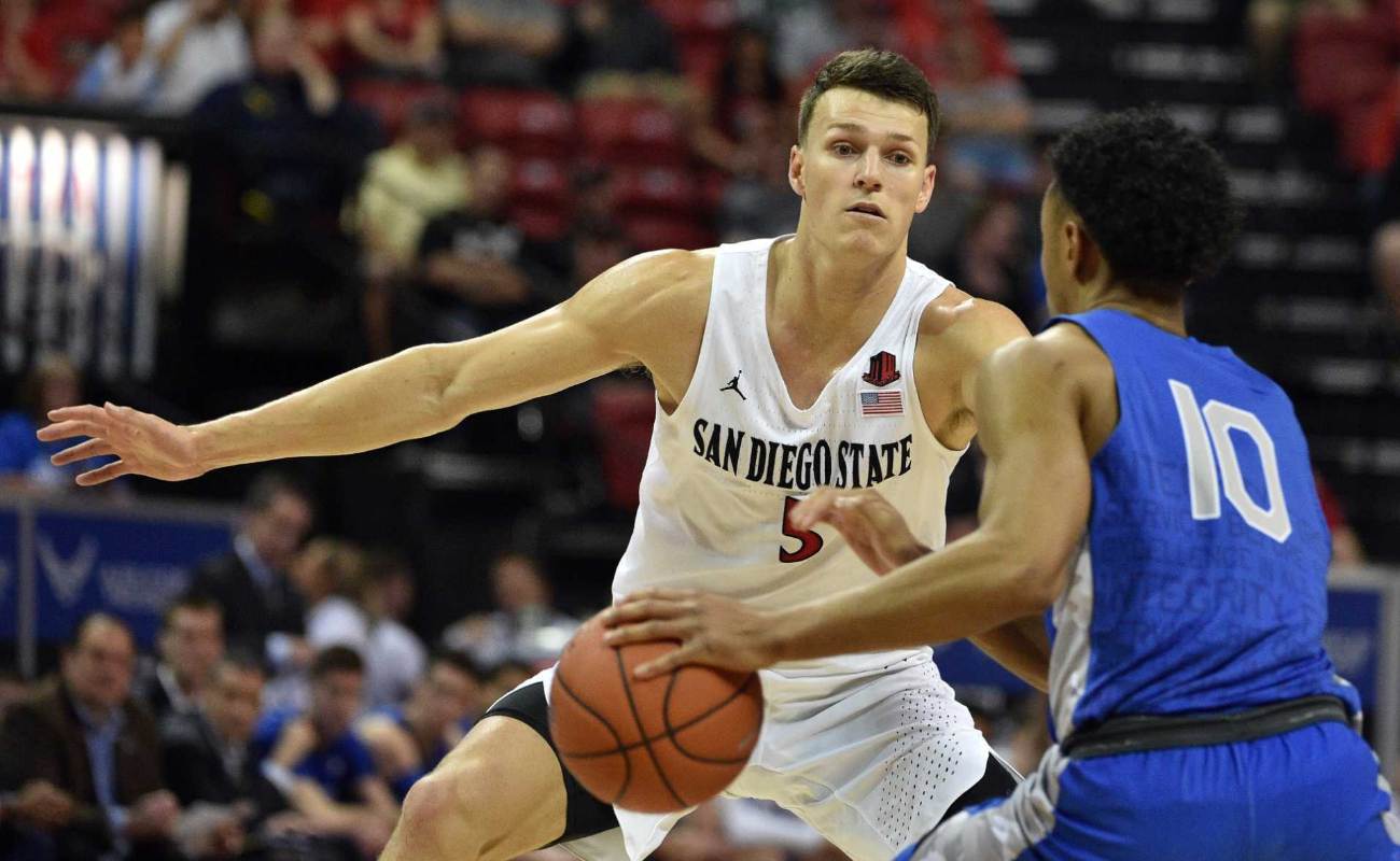 Yanni Wetzell of San Diego State Aztecs defends against A.J. Walker of Air Force Falcons