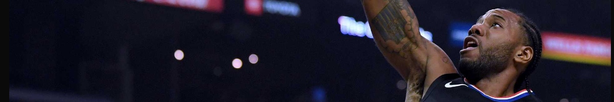 Kawhi Leonard #2 of the LA Clippers scores on a dunk during game against Denver Nuggets at Staples Center