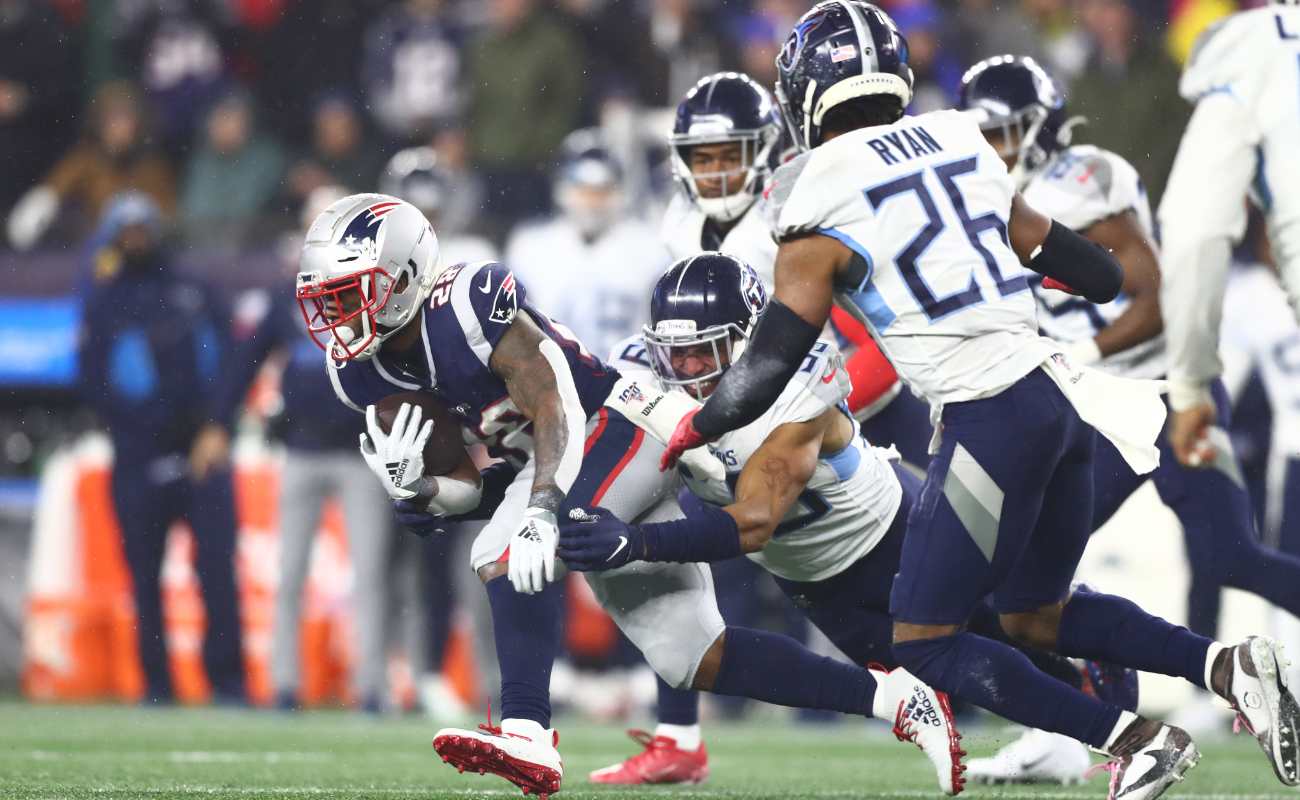 James White #28 of the New England Patriots carries ball against Tennessee Titans in the AFC Wild Card Playoff game