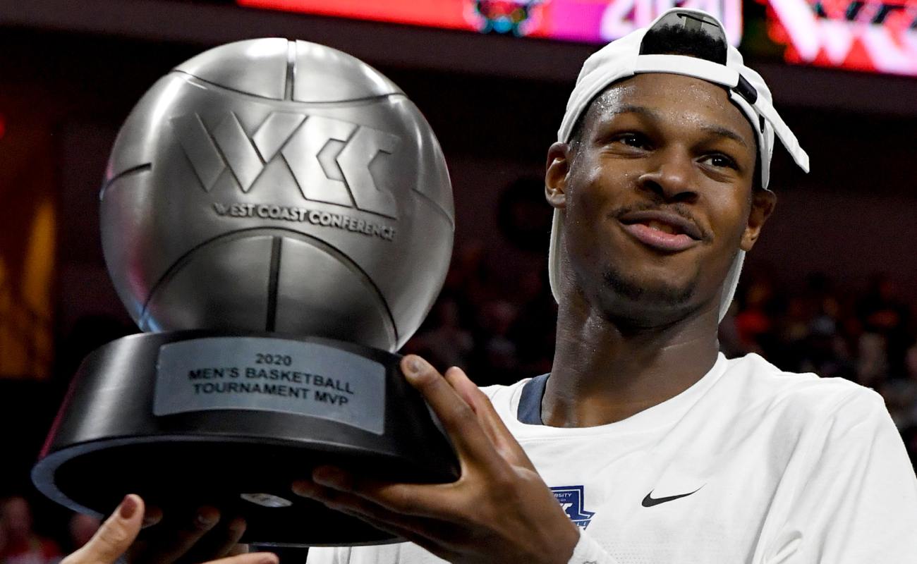 Joel Ayayi #11 of Gonzaga Bulldogs holds up most outstanding player award at West Coast Conference basketball tournament