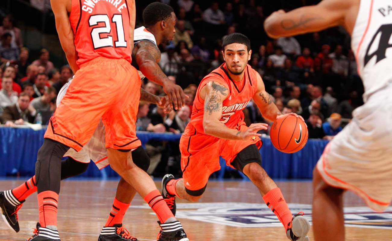 University of Louisville guard Peyton Siva dribbling basketball