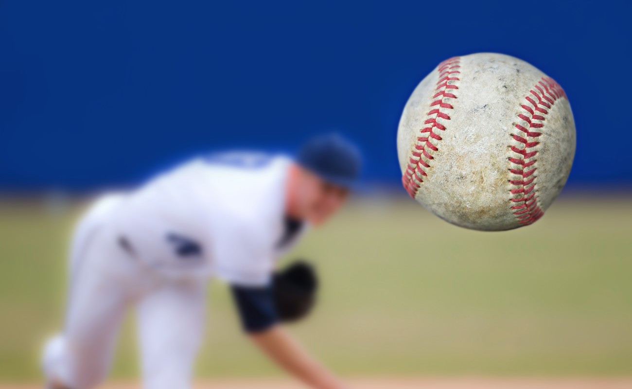 Baseball pitcher throwing ball