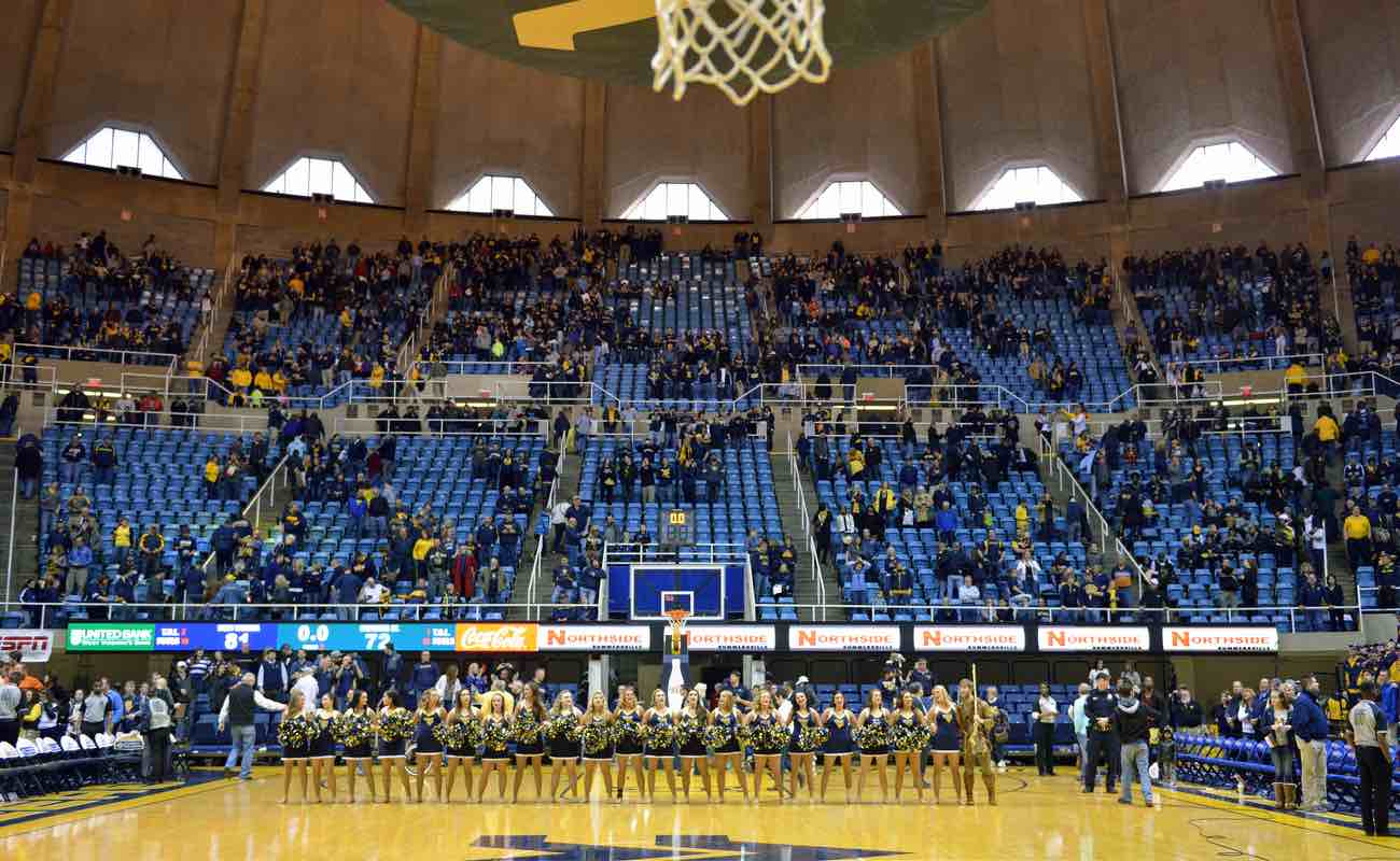 The WVU dance team lines up on the court in full stadium