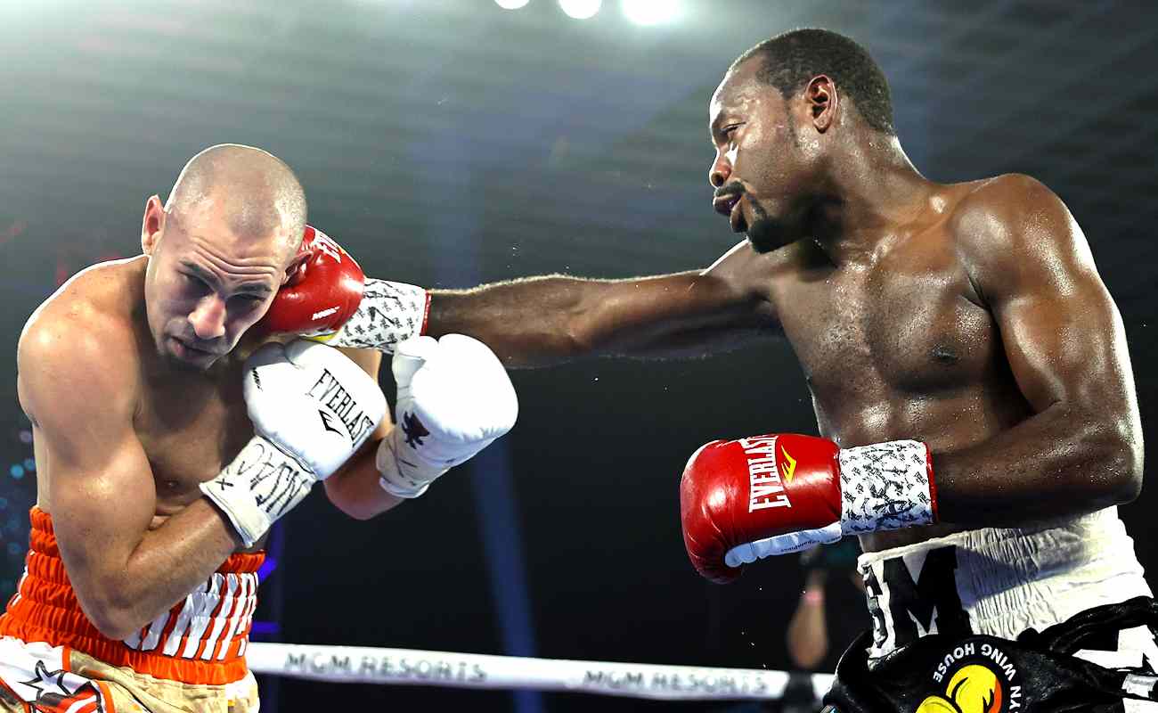 Junior welterweight boxer Jose Pedraza is punched by Mikkel LesPierre in the boxing ring.