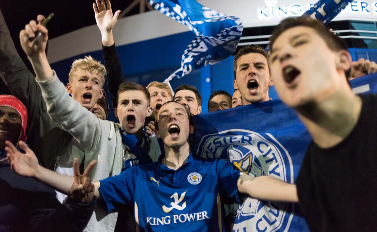 Leicester city fans out on the streets celebrating the premier league title