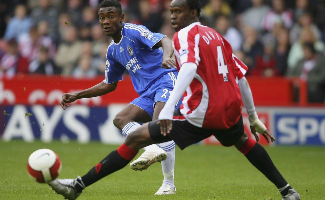 Chelsea striker Salomon Kalou gets in a shot past Sheff United defender Claude Davis during Barclays Premier League match