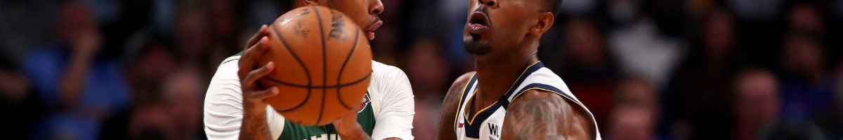 Will Barton #5 of the Denver Nuggets defends Sterling Brown #23 of the Milwaukee Bucks at Pepsi Center