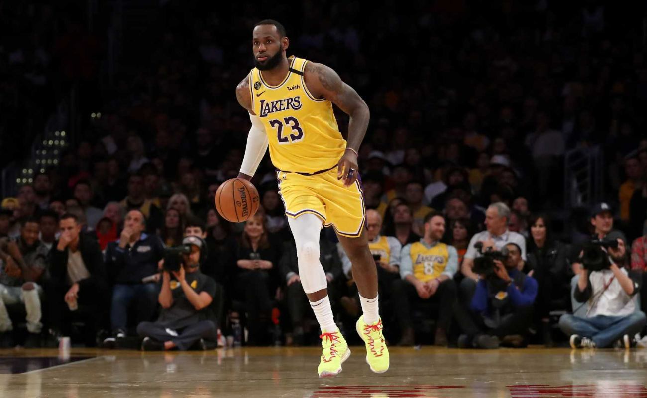 LeBron James #23 of the Los Angeles Lakers dribbles down the court in a game against the Philadelphia 76ers