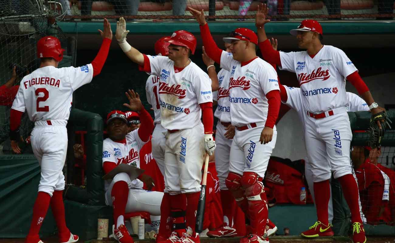 Carlos Figueroa of Diablos celebrates after scoring during the match between Rojos del Aguila and Diablos Rojos.