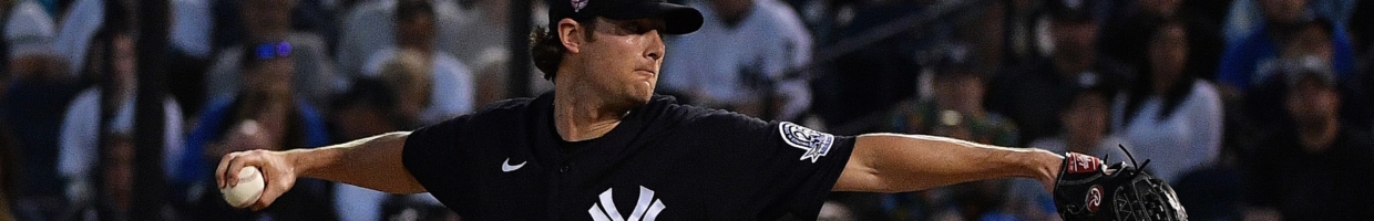 Gerrit Cole #45 of the New York Yankees delivers a pitch during the spring training game