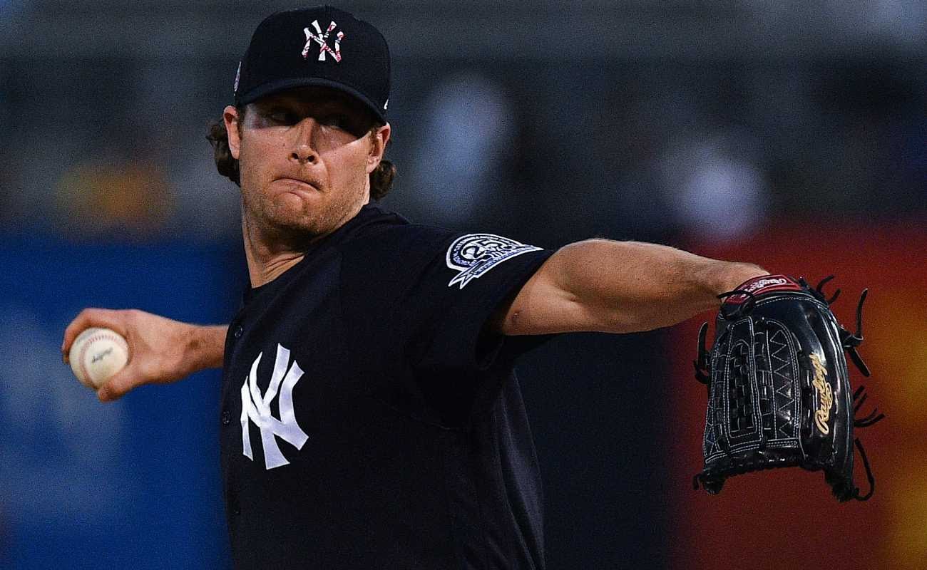 Gerrit Cole #45 of the New York Yankees delivers a pitch during spring training game against Pittsburgh Pirates