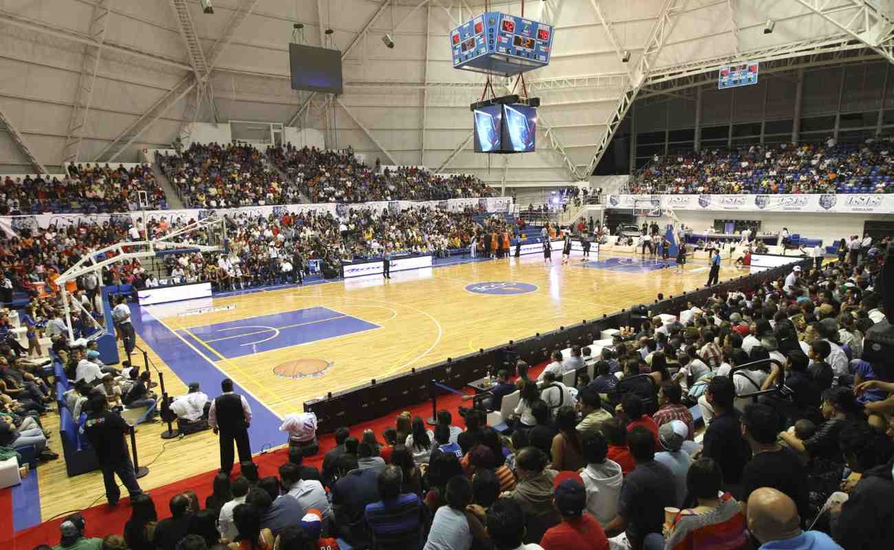 Basketball court with fans ready to watch game.