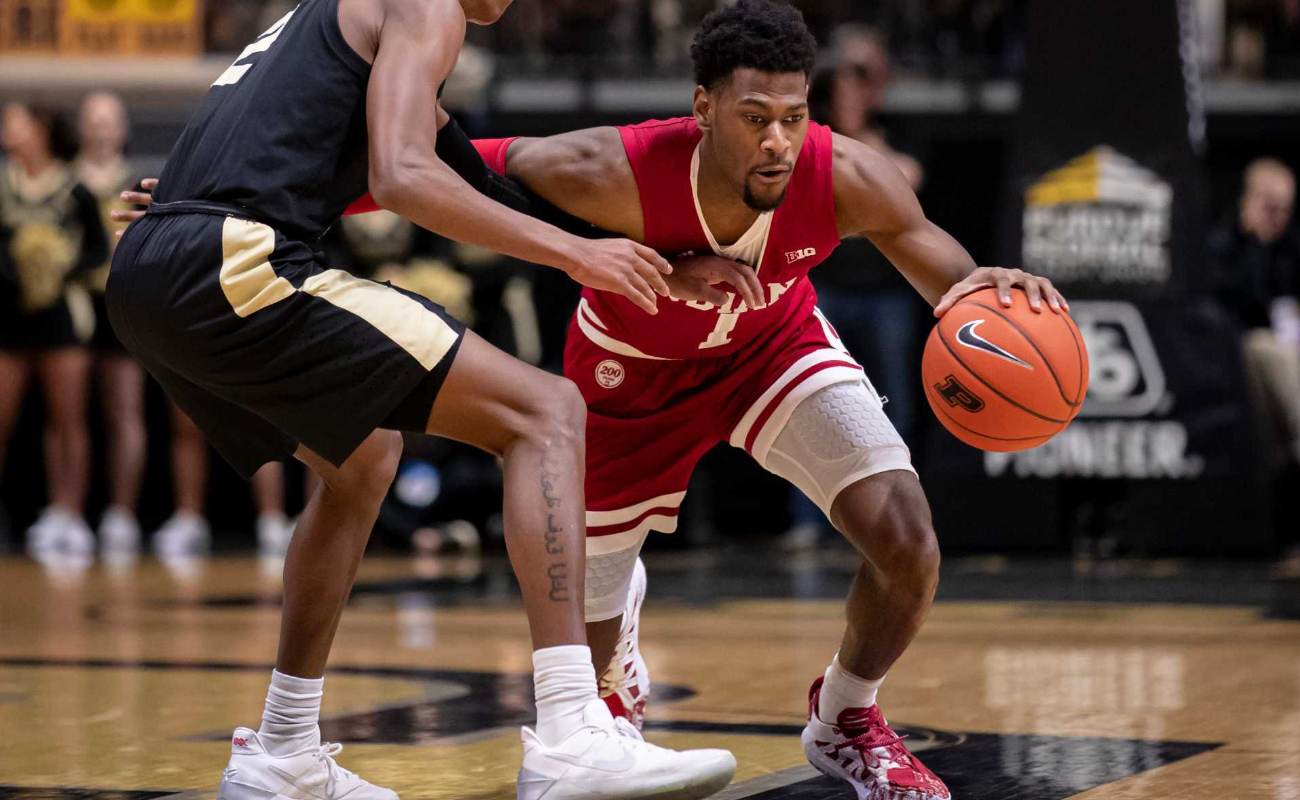Al Durham #1 of the Indiana Hoosiers dribbles ball against Eric Hunter Jr. #2 of Purdue Boilermakers