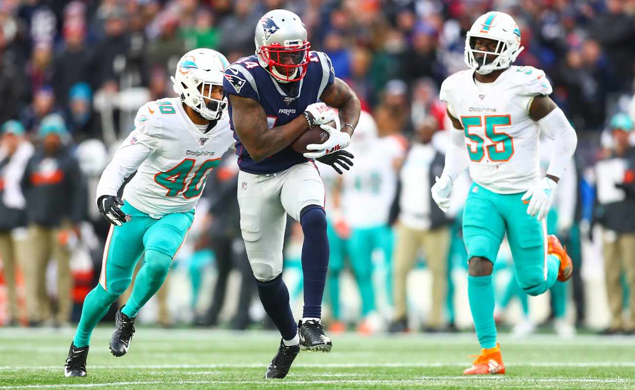 Mohamed Sanu of New England Patriots runs ball during game against Miami Dolphins