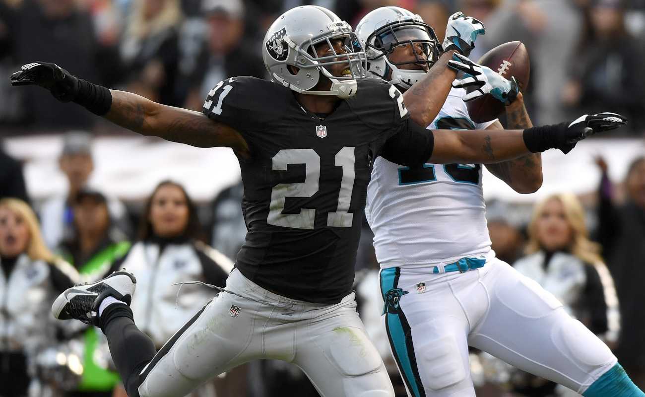 Kelvin Benjamin of Carolina Panthers catches pass over Sean Smith of Oakland Raiders during NFL game 2016