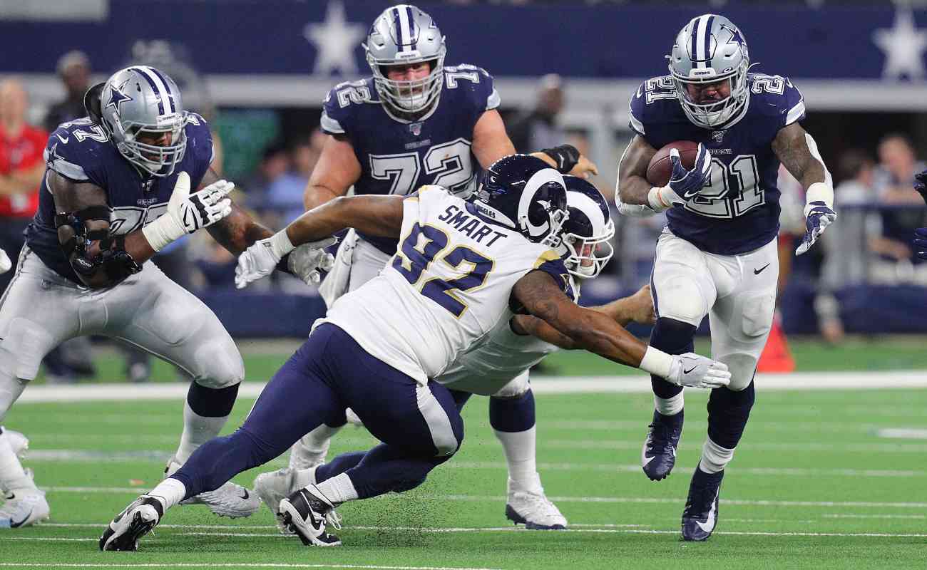 Tanzel Smart of Los Angeles Rams against Ezekiel Elliott of Dallas Cowboys at AT&T Stadium