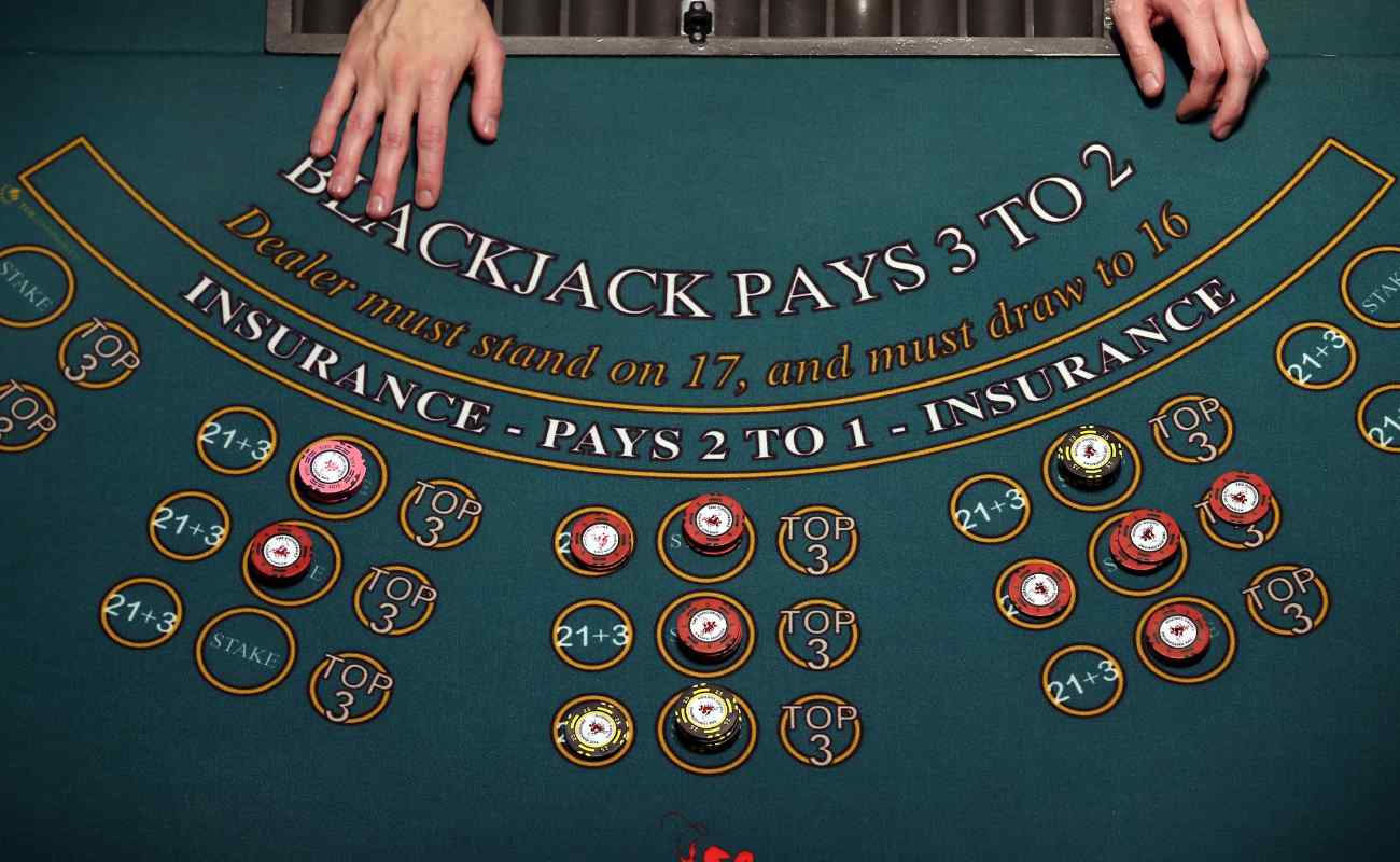 A croupier working at a blackjack table