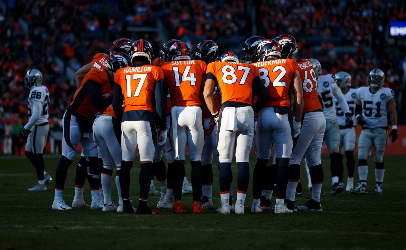 Denver Broncos huddle against Oakland Raiders during game at Empower Field on December 29, 2019