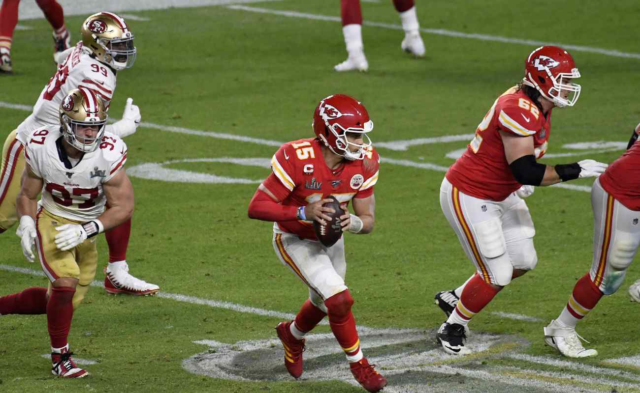 Patrick Mahomes #15 of the Kansas City Chiefs scrambles away from the pressure against the San Francisco 49ers in Super Bowl LIV at Hard Rock Stadium on February 02, 2020