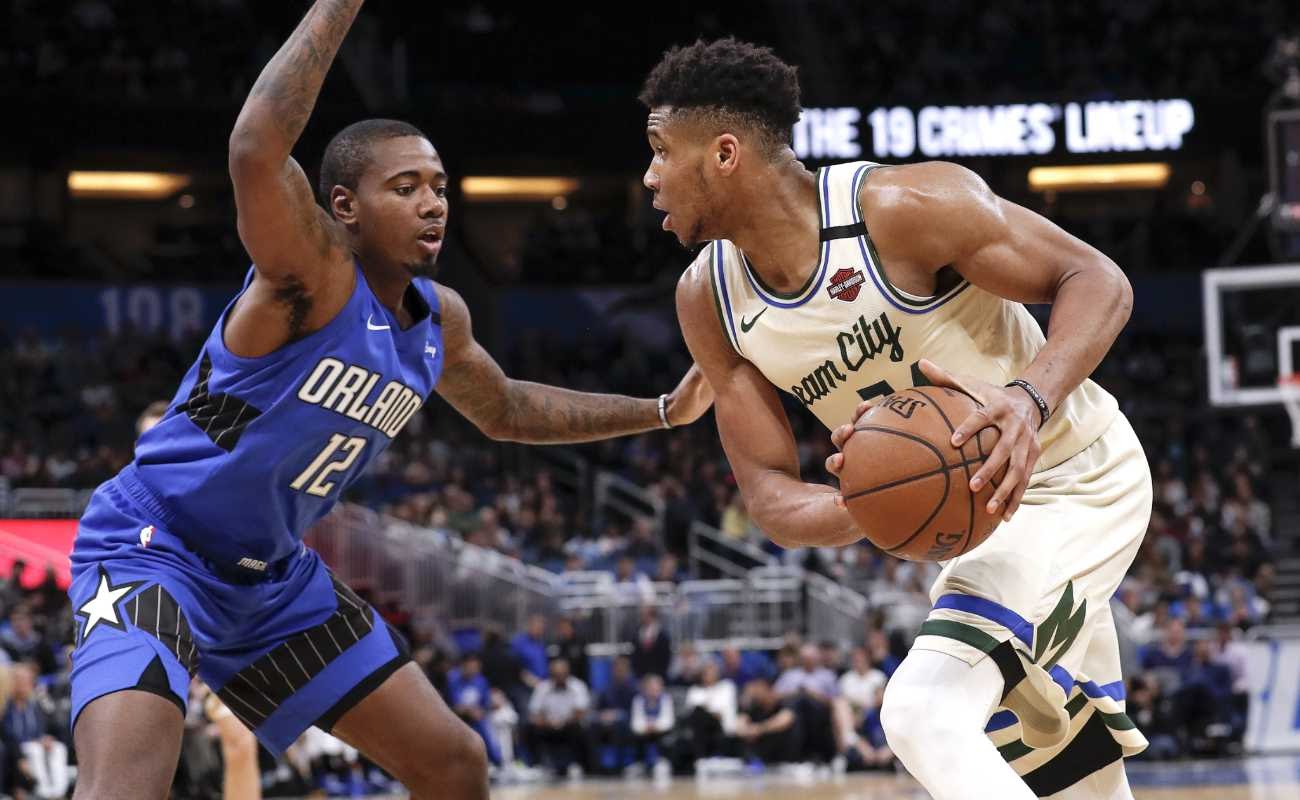 Gary Clark of Orlando Magic defends Giannis Antetokounmpo of Milwaukee Bucks on February 8, 2020