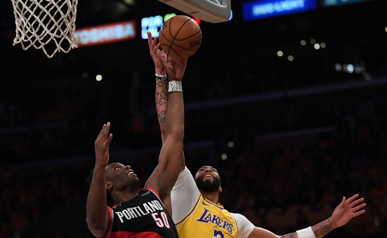 Anthony Davis ofLos Angeles Lakers and Caleb Swanigan of Portland Trail Blazers on January 31, 2020