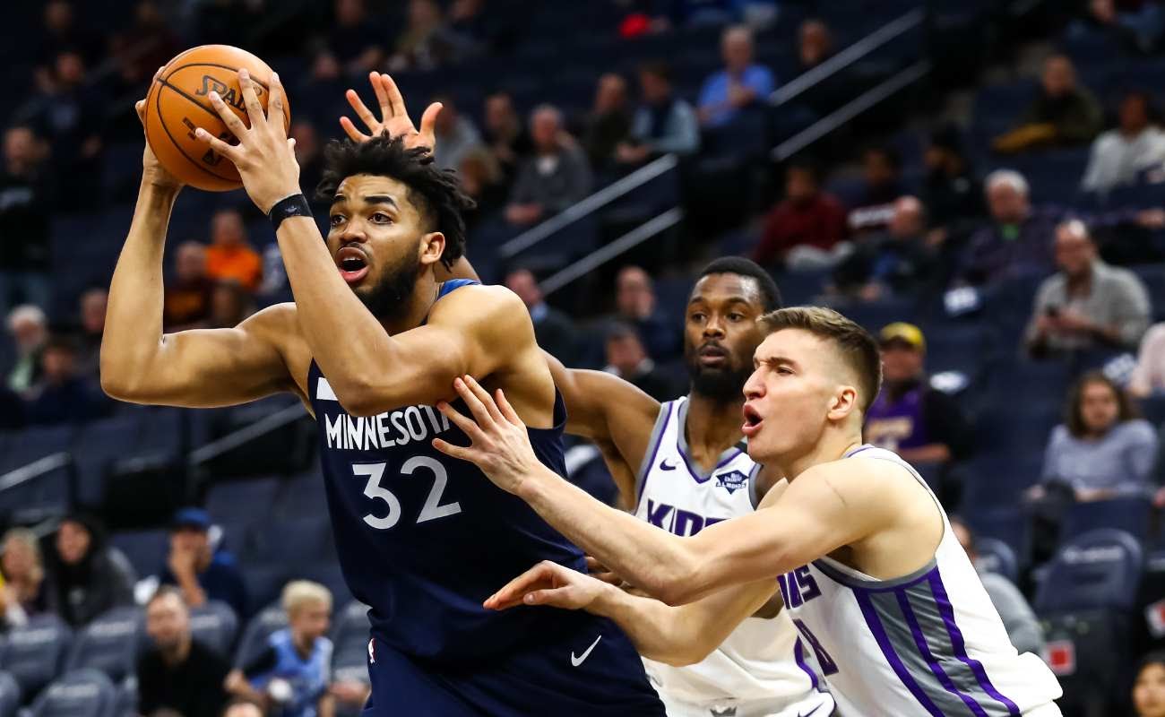 Karl-Anthony Towns of Minnesota Timberwolves against Bogdan Bogdanovic of Sacramento Kings at Target Center