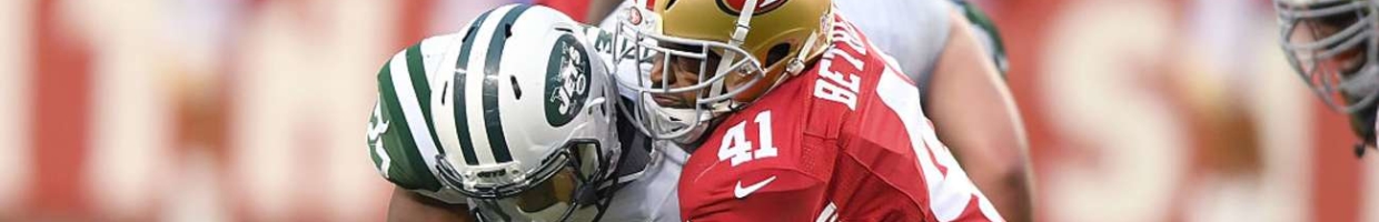 Bilal Powell of the New York Jets gets tackled by Antoine Bethea of the San Francisco 49ers