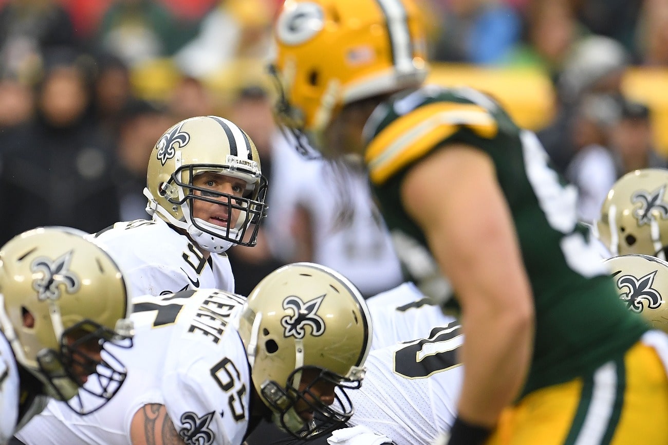 Drew Brees #9 of the New Orleans Saints anticipates a snap during a game against the Green Bay Packers at Lambeau Field on October 22, 2017 in Green Bay, Wisconsin.