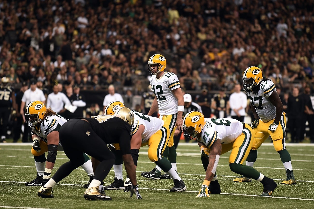 Aaron Rodgers #12 of the Green Bay Packers anticipates a play against the New Orleans Saints during the third quarter of a game at Mercedes-Benz Superdome on October 26, 2014 in New Orleans, Louisiana.