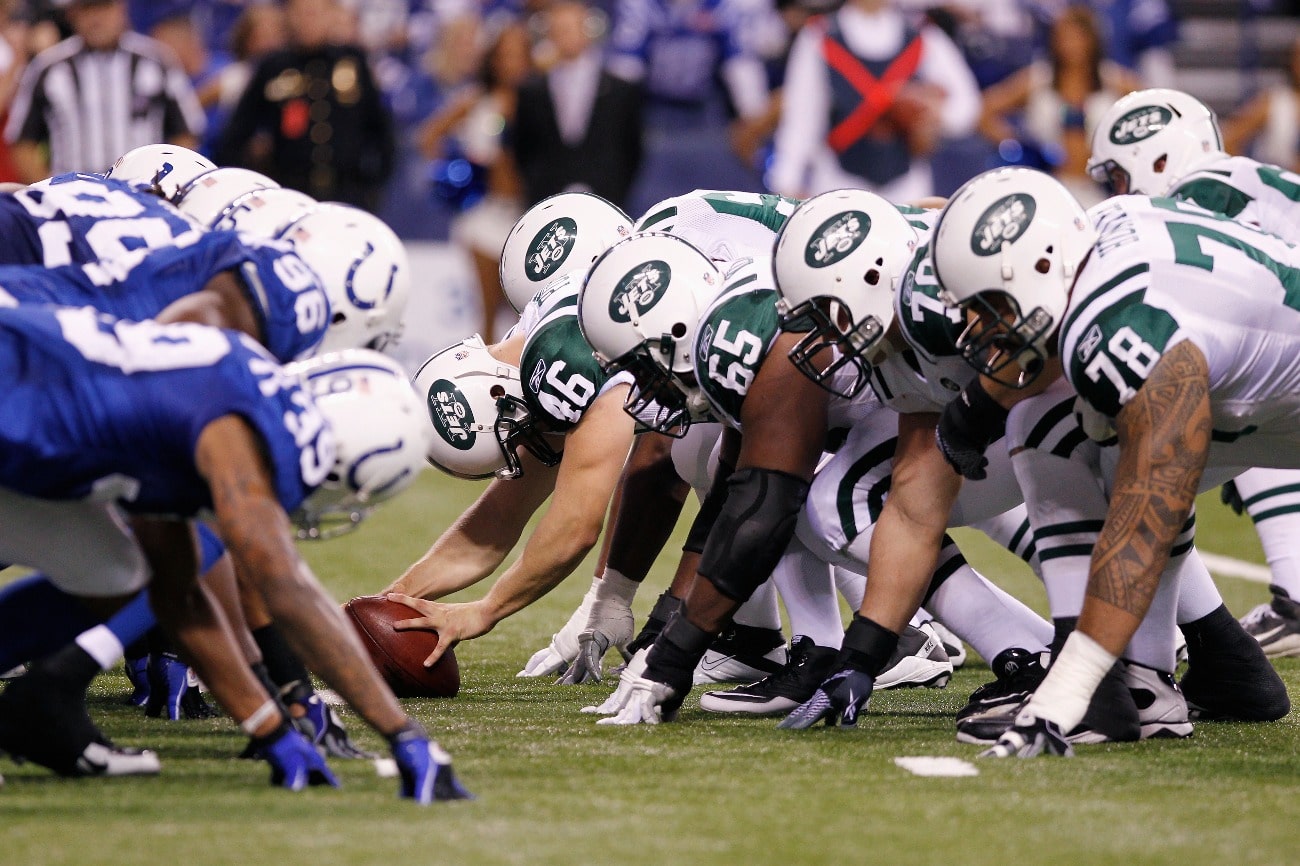 The New York Jets face off at the line of scrimmage against the Indianapolis Colts in the 2011 AFC Wild Card playoff at Lucas Oil Stadium on January 8, 2011 in Indianapolis, Indiana.