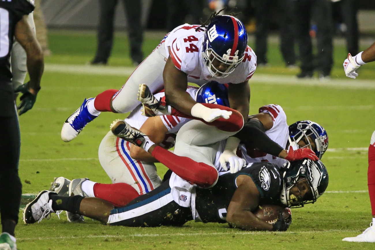 Boston Scott #35 of the Philadelphia Eagles is stopped by the New York Giants defense on a carry during the first quarter at Lincoln Financial Field on October 22, 2020 in Philadelphia, Pennsylvania.