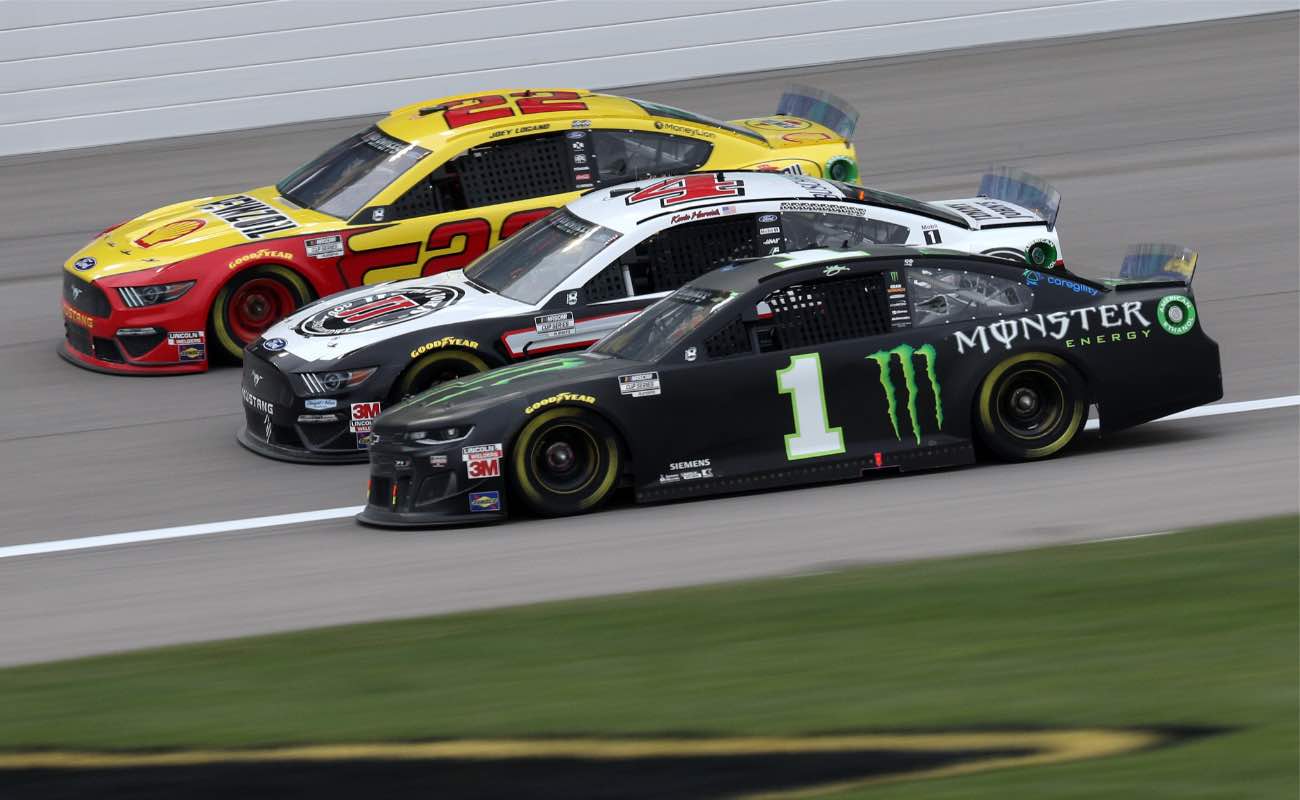 Kurt Busch, driver of the #1 Monster Energy Chevrolet, races Kevin Harvick, driver of the #4 Jimmy John's Ford, and Joey Logano, driver of the #22 Shell Pennzoil Ford October 2020.