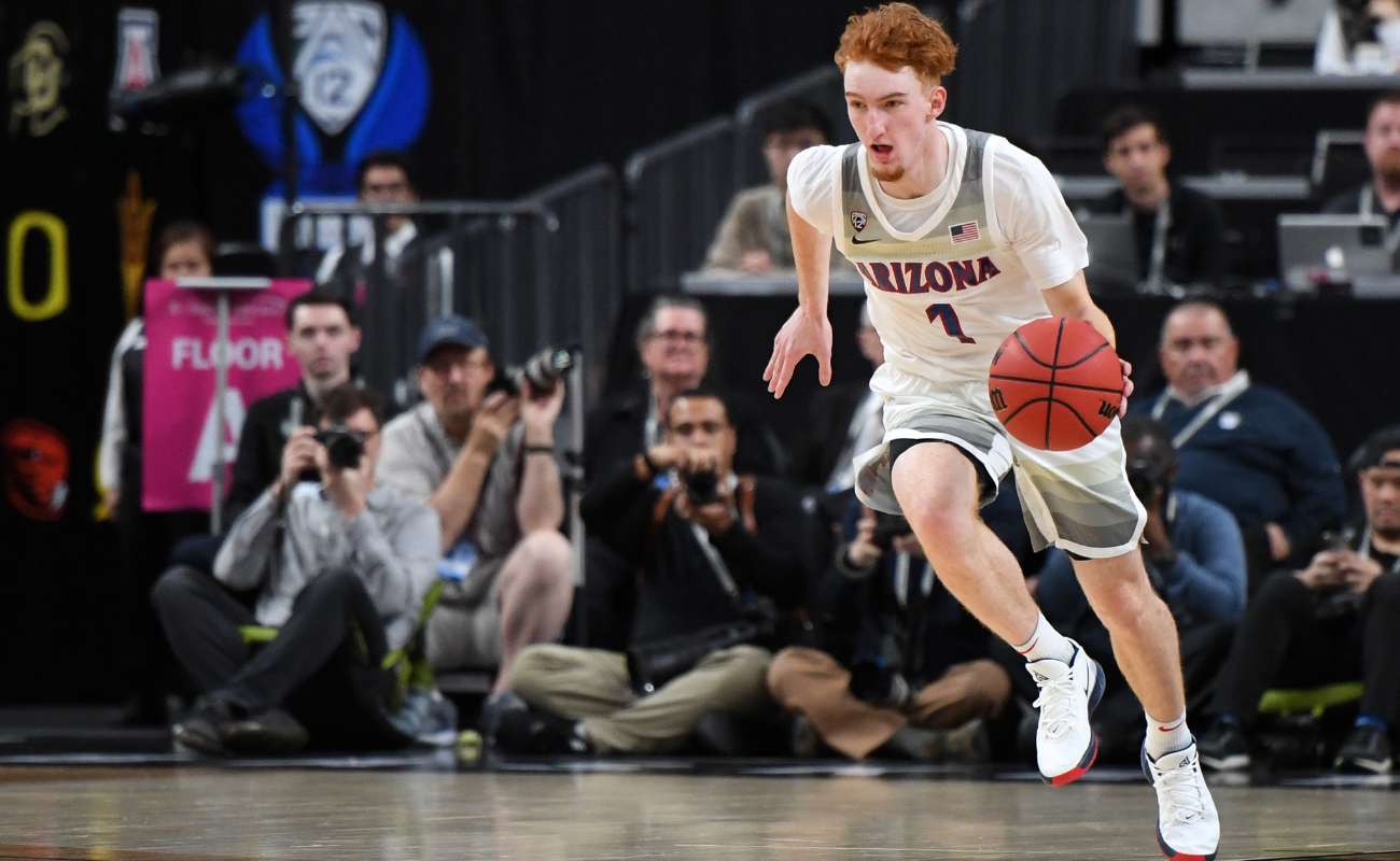 Nico Mannion brings the ball up the court. Ethan Miller/Getty Images