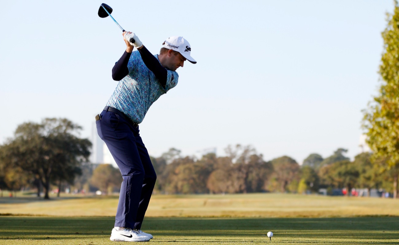 Russell Knox of Scotland plays his shot from the first tee during the third round of the Houston Open at Memorial Park Golf Course on November 07, 2020 in Houston, Texas.