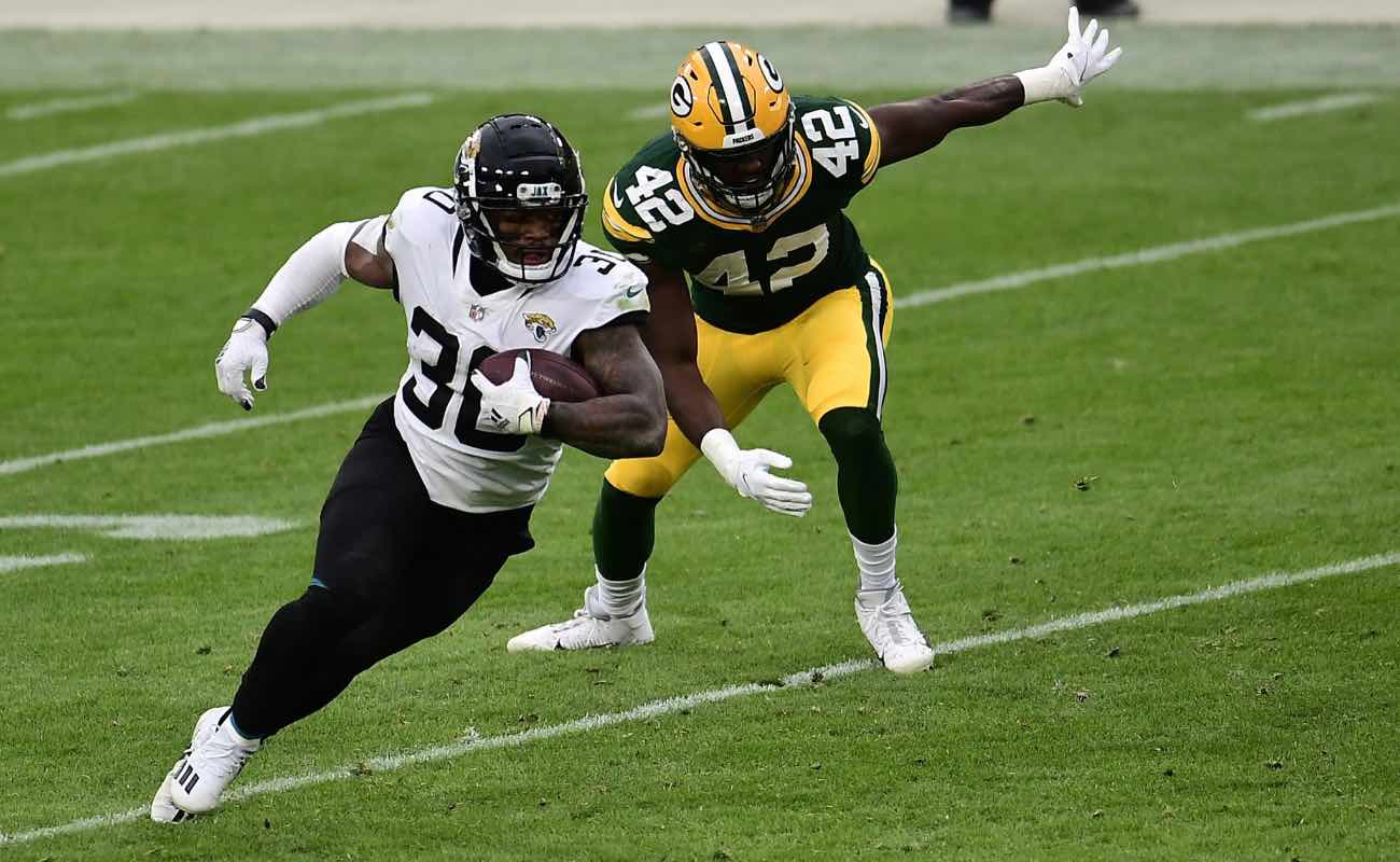 James Robinson ofJacksonville Jaguars against Oren Burks of Green Bay Packers at Lambeau Field November 2020.