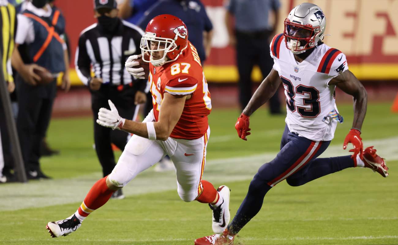 Travis Kelce of Kansas City Chiefs running past Joejuan Williams of New England Patriots at Arrowhead Stadium October 2020