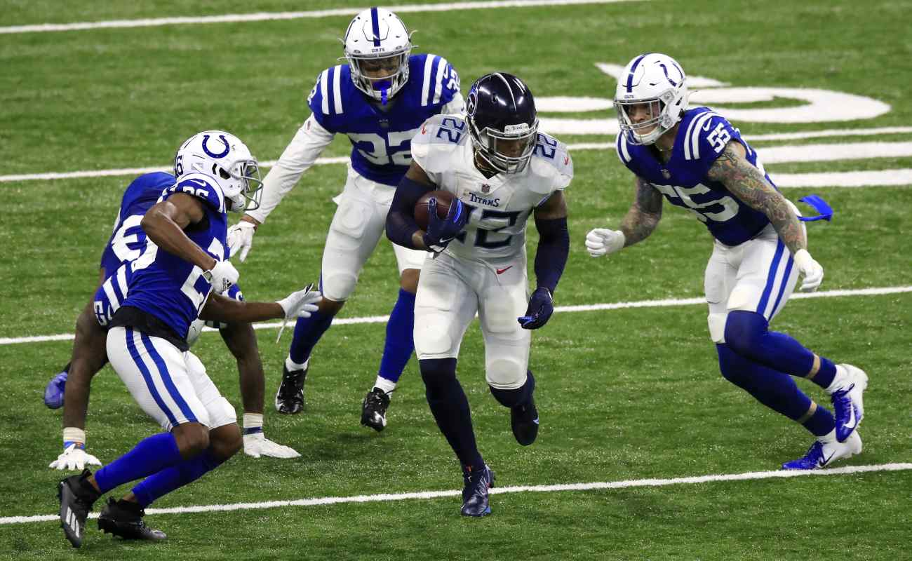 Tennessee Titans’ player Derrick Henry surrounded by four Indiana Colts players. Photo by Andy Lyons/Getty Images