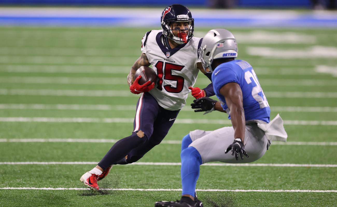Will Fuller of the Houston Texans tries to evade Duron Harmon of the Detroit Lions. Photo by Gregory Shamus/Getty Images