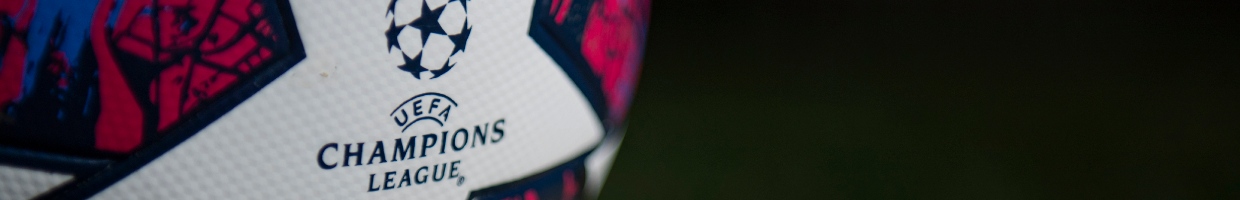 The Official Adidas Champions League Match Ball on a Green Background - Photo by VISIONHAUS