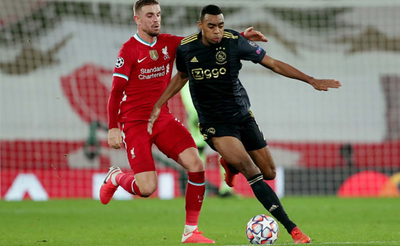 Jordan Henderson of Liverpool Looks to Tackle Ryan Gravenberch of Ajax - Photo by Richard Sellers