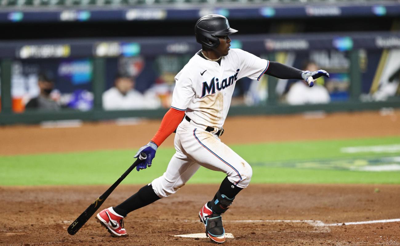 Miami Marlins’ Jazz Chisholm ready to run after hitting the ball. (Photo by Elsa/Getty Images)