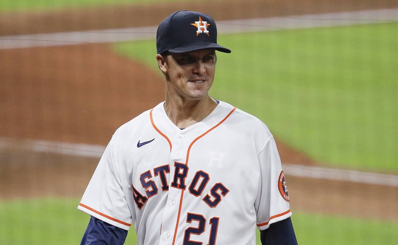 Zack Greinke of the Houston Astros walks to the dugout smiling. Photo by Bob Levey/Getty Images