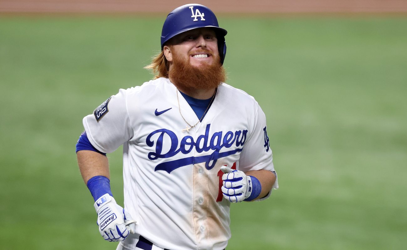Los Angeles Dodgers’ Justin Turner smiles as he runs. Photo by Tom Pennington/Getty Images