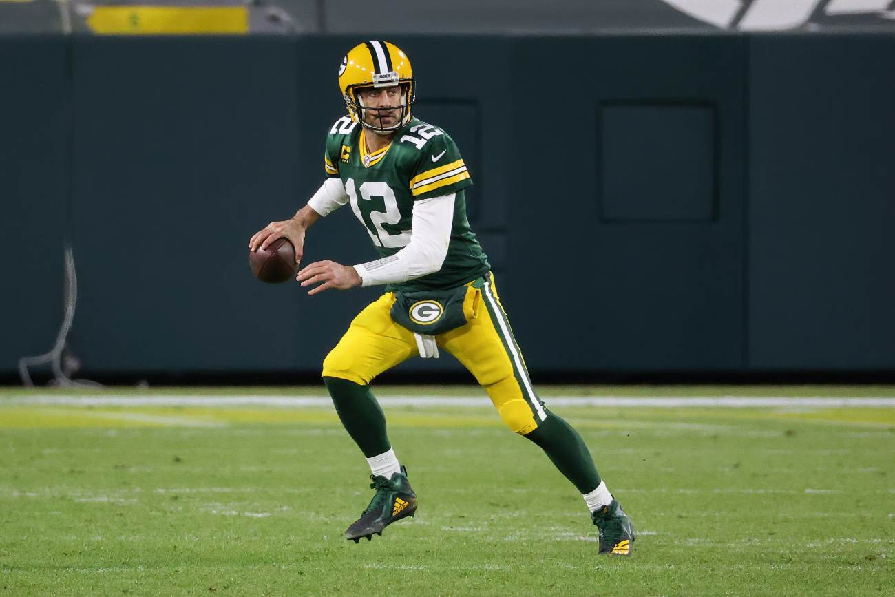 GREEN BAY, WISCONSIN - DECEMBER 06: Aaron Rodgers #12 of the Green Bay Packers drops back to pass in the third quarter against the Philadelphia Eagles at Lambeau Field on December 06, 2020 in Green Bay, Wisconsin. (Photo by Dylan Buell/Getty Images)
