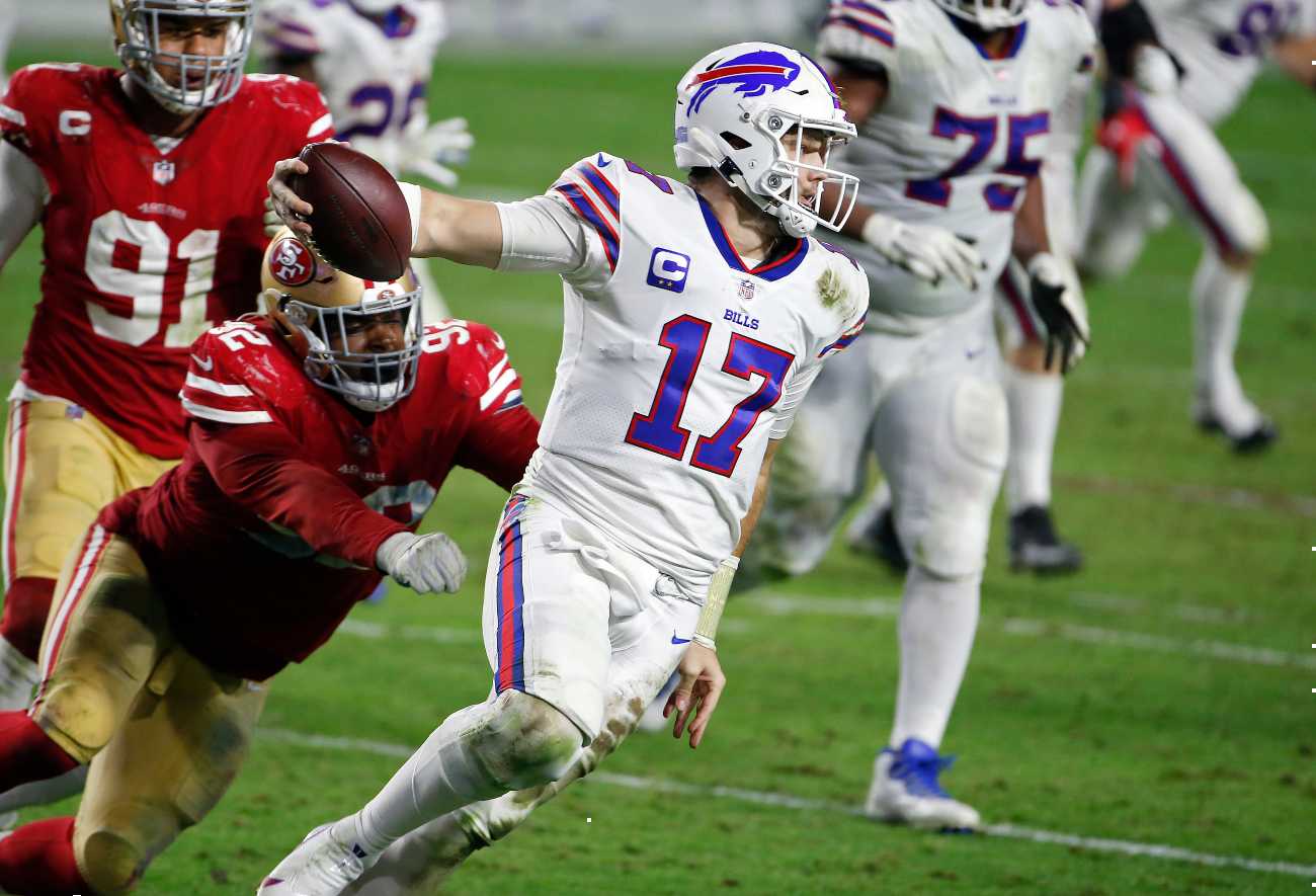 GLENDALE, ARIZONA - DECEMBER 07: Quarterback Josh Allen #17 of the Buffalo Bills scrambles to avoid a sack by defensive end Kerry Hyder Jr. #92 of the San Francisco 49ers during the second half of the NFL football game at State Farm Stadium on December 07, 2020 in Glendale, Arizona. (Photo by Ralph Freso/Getty Images)