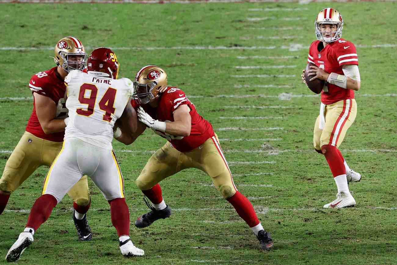 GLENDALE, ARIZONA - DECEMBER 13: Quarterback Nick Mullens #4 of the San Francisco 49ers drops back to pass during the fourth quarter of the NFL game against the Washington Football Team at State Farm Stadium on December 13, 2020 in Glendale, Arizona. The Washington Football Team defeated the 49ers 23-15. (Photo by Christian Petersen/Getty Images)